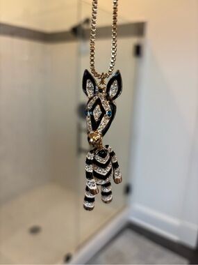 Enamel Zebra Pendant Necklace with Rhinestones - Black & Gold
30 inch chain.